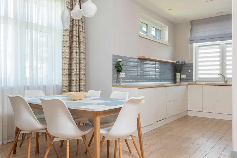 Interior design of contemporary kitchen in minimalist style with natural colors and materials